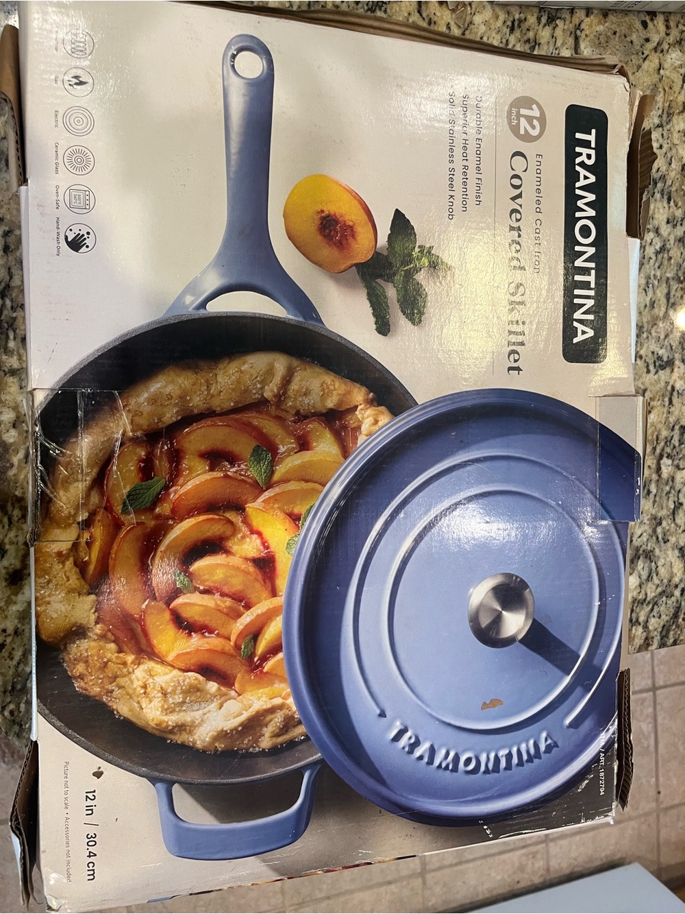 Tramontina 12" Enameled Cast Iron Skillet with Lid in blue.